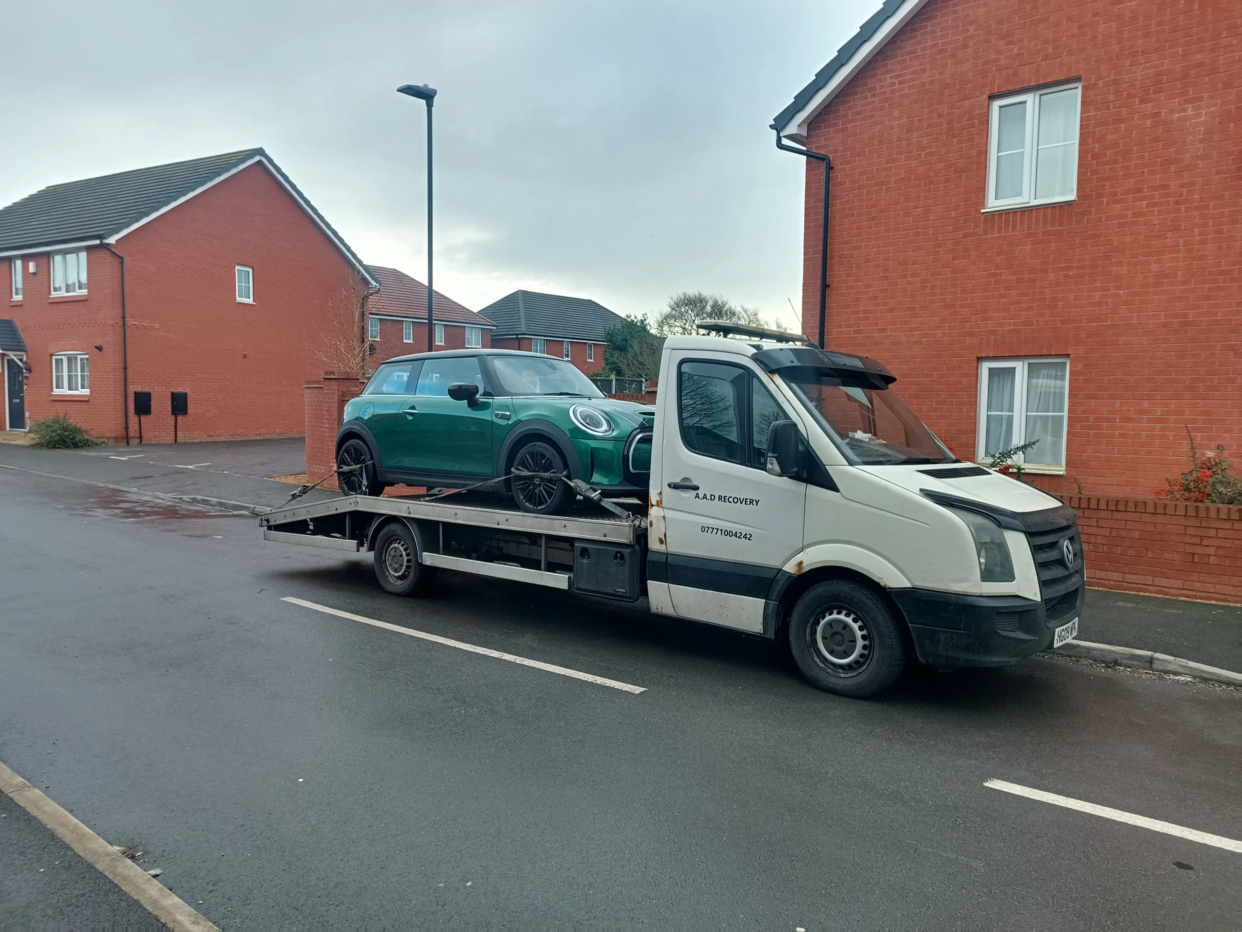 Car being towed on an AAD Transport & Recovery tow truck in Birmingham